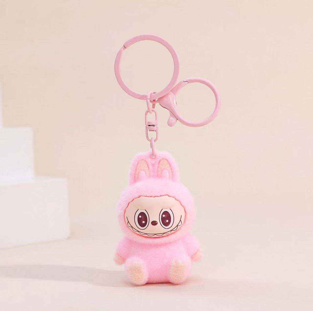 Labubu Sherling Plush Keychain – Pastel Mini Doll on Swirl Cookie Seat